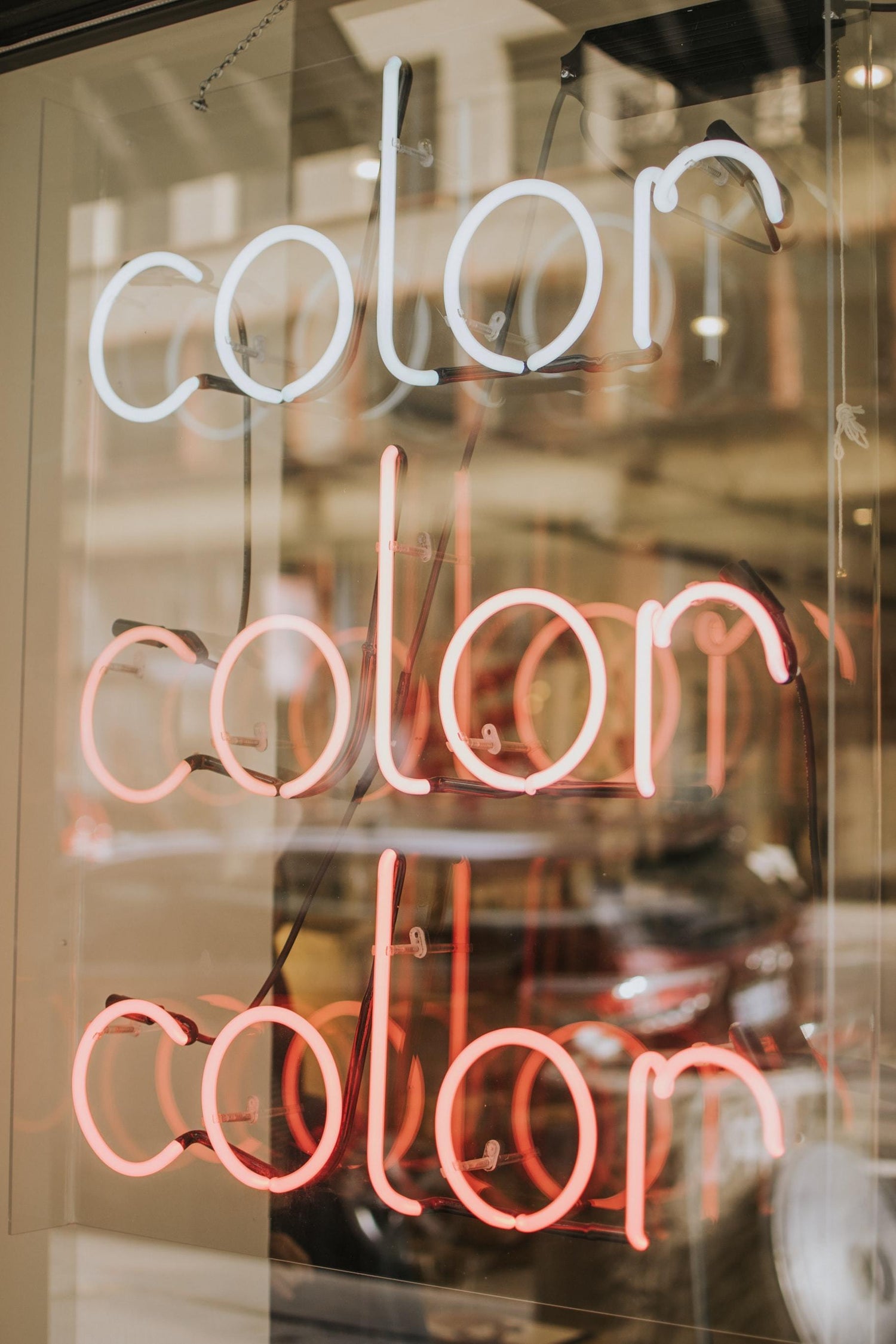 Color neon sign in hairdressing shop window